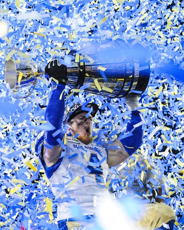 CALGARY, AB - NOVEMBER 24: Adam Bighill #4 of the Winnipeg Blue Bombers holds up the Grey Cup after defeating the Hamilton Tiger-Cats during the 107th Grey Cup Championship Game at McMahon Stadium on November 24, 2019 in Calgary, Alberta, Canada. (Photo by Derek Leung/Getty Images)