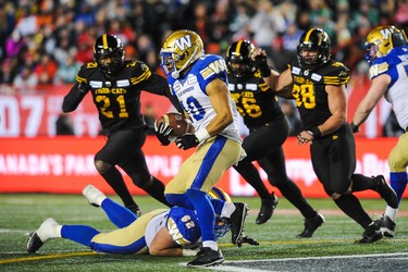 CALGARY, AB - NOVEMBER 24: Nic Demski #10 of the Winnipeg Blue Bombers carries the ball against the Hamilton Tiger-Cats during the 107th Grey Cup Championship Game at McMahon Stadium on November 24, 2019 in Calgary, Alberta, Canada. (Photo by Derek Leung/Getty Images)