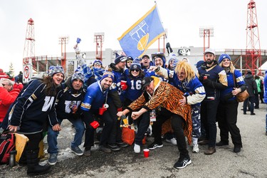 CALGARY, AB - NOVEMBER 24: Winnipeg Blue Bombers fans and a single Hamilton Tiger-Cats fan rally their team prior to the 107th Grey Cup Championship Game against the Hamilton Tiger-Cats during at McMahon Stadium on November 24, 2019 in Calgary, Alberta, Canada. (Photo by Derek Leung/Getty Images)