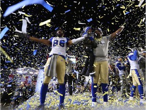 The Winnipeg Blue Bombers Rasheed Bailey raises his arms with teammates as they celebrate in the confetti after the Bombers defeated the Hamilton Tiger-Cats 33-12 to win the 107th Grey Cup in Calgary Sunday, November 24, 2019.