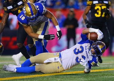 Andrew Harris of the Winnipeg Blue Bombers goes in for a touchdown during the 107th Grey Cup CFL championship football game in Calgary on Sunday, November 24, 2019. Al Charest/Postmedia