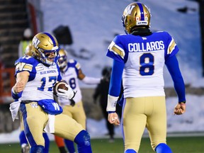 Winnipeg Blue Bombers Chris Streveler celebrates with fellow quarterback Zach Collaros during the CFL's West Division semifinal against Calgary Stampeders at McMahon Stadium on Sunday.