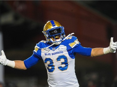 CALGARY, AB - NOVEMBER 24: Andrew Harris #33 of the Winnipeg Blue Bombers celebrates after scoring a touchdown against the Hamilton Tiger-Cats during the 107th Grey Cup Championship Game at McMahon Stadium on November 24, 2019 in Calgary, Alberta, Canada. (Photo by Derek Leung/Getty Images) ORG XMIT: 775411982