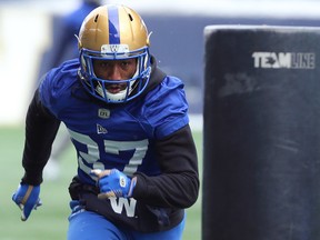 Safety Brandon Alexander charges a tackling dummy during Winnipeg Blue Bombers practice in Winnipeg on Wed., Nov. 13, 2019.