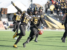 Hamilton Tiger Cats wide receiver Brandon Banks (16) celebrates his touchdown reception from quarterback Dane Evans in Hamilton on Sunday. THE CANADIAN PRESS/Peter Power