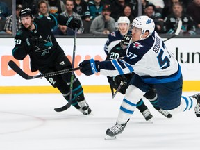 Jets forward Gabriel Bourque shoots and scores against the Sharks in San Jose last night. John HeftiUSA TODAY Sports