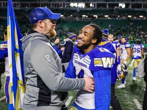 Winnipeg Blue Bombers head coach Mike O'Shea and Winnipeg Blue Bombers defensive back Marcus Sayles (14) after defeating Saskatchewan Roughriders during the CFL Western Conference Final football game at Mosaic Stadium on Nov. 17, 2019.  Sergei Belski-USA TODAY Sports