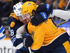 Nashville Predators left wing Filip Forsberg (9) and Winnipeg Jets defenceman Nathan Beaulieu (88) wrestle after the whistle during the first period at Bridgestone Arena. : Christopher Hanewinckel-USA TODAY Sports XMIT: USATSI-405318