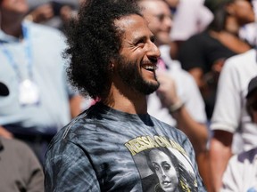 In this file photo taken on August 29, 2019 former San Francisco 49er's quarterback Colin Kaepernick watches the Women's Singles match of Naomi Osaka and Magda Linette during their Round 2 women's Singles match at the 2019 US Open at the USTA Billie Jean King National Tennis Center in New York.
