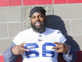 Blue Bombers’ Stanley Bryant is all smiles during their practice in Calgary yesterday. Darren Makowichuk/Postmedia Network