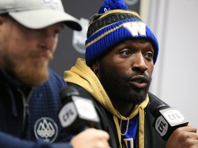 Winnipeg Blue Bombers linebacker Adam Bighill, left and defensive lineman Willie Jefferson talk with media at McMahon Stadium in Calgary on Saturday.