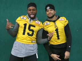 Hamilton Tiger-Cats Marcus Tucker, left, and Anthony Coombs play to the camera at the Macron Performance Centre in Calgary.