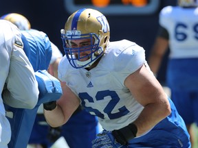 Bombers centre Cody Speller (right) did his job well in last Sunday’s playoff win over the Calgary Stampeders as the team racked up 195 rushing yards behind its physical and will-imposing offensive line. (Kevin King/Winnipeg Sun)