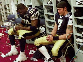 Dejected Winnipeg Blue Bombers Wayne Weathers and Troy Westwood after being defeated by the Calgary Stampeders during the 2001 Grey Cup.  JOHN KENNEY/POSTMEDIA FILE