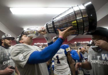 Winnipeg Blue Bombers quarterback Zach Collaros drinks from the Cup as they celebrate winning the 107th Grey Cup against the Hamilton Tiger Cats in Calgary, Alta., Sunday, November 24, 2019. THE CANADIAN PRESS/Nathan Denette