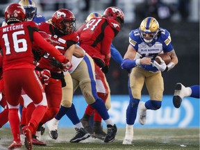 The Saskatchewan Roughriders will have to contend with the running of Winnipeg Blue Bombers quarterback Chris Streveler, right, during Sunday's CFL West Division final at Mosaic Stadium.