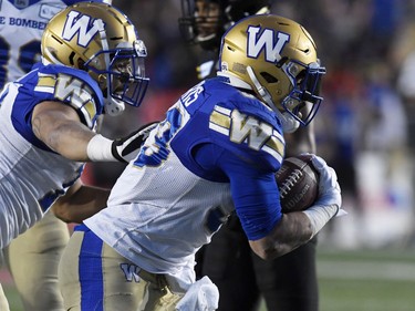 Nov 24, 2019; Calgary, Alberta, CAN; Winnipeg Blue Bombers running back Andrew Harris (33) celebrates with teammates after scoring a touchdown against the Hamilton Tiger-Cats in the first half during the 107th Grey Cup championship football game at McMahon Stadium. Mandatory Credit: Eric Bolte-USA TODAY Sports ORG XMIT: USATSI-408191