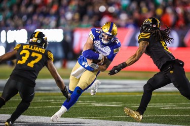 Nov 24, 2019; Calgary, Alberta, CAN; Winnipeg Blue Bombers quarterback Chris Streveler (17) runs with the ball against the Hamilton Tiger-Cats in the second half during the 107th Grey Cup championship football game at McMahon Stadium. Mandatory Credit: Sergei Belski-USA TODAY Sports