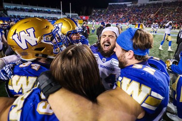 Nov 24, 2019; Calgary, Alberta, CAN; Winnipeg Blue Bombers players celebrate on the sideline in the second half against the Hamilton Tiger-Cats during the 107th Grey Cup championship football game at McMahon Stadium. Mandatory Credit: Sergei Belski-USA TODAY Sports