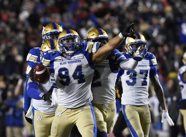 Nov 24, 2019; Calgary, Alberta, CAN; Winnipeg Blue Bombers defensive end Jackson Jeffcoat (94) reacts with teammates after recovering a Hamilton Tiger-Cats fumble in the second half during the 107th Grey Cup championship football game at McMahon Stadium. Mandatory Credit: Eric Bolte-USA TODAY Sports