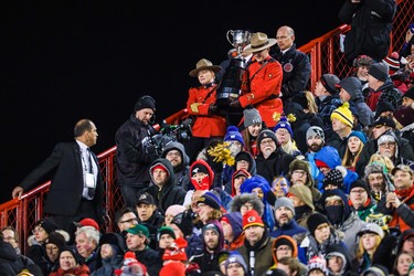 Nov 24, 2019; Calgary, Alberta, CAN; RCMP officers bring the Grey Cup down to the field in the second half game between the Winnipeg Blue Bombers and the Hamilton Tiger-Cats during the 107th Grey Cup championship football game at McMahon Stadium. Mandatory Credit: Sergei Belski-USA TODAY Sports