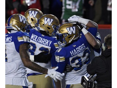 Nov 24, 2019; Calgary, Alberta, CAN; Winnipeg Blue Bombers running back Andrew Harris (33) celebrates with teammates after scoring a touchdown against the Hamilton Tiger-Cats in the first half during the 107th Grey Cup championship football game at McMahon Stadium. Mandatory Credit: Eric Bolte-USA TODAY Sports ORG XMIT: USATSI-408191