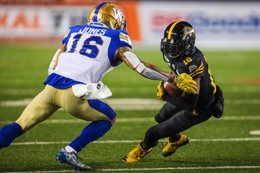 Nov 24, 2019; Calgary, Alberta, CAN; Hamilton Tiger-Cats wide receiver Brandon Banks (16) runs with the ball in front of Winnipeg Blue Bombers defensive back Mike Jones (16) in the first half during the 107th Grey Cup championship football game at McMahon Stadium. Mandatory Credit: Sergei Belski-USA TODAY Sports
