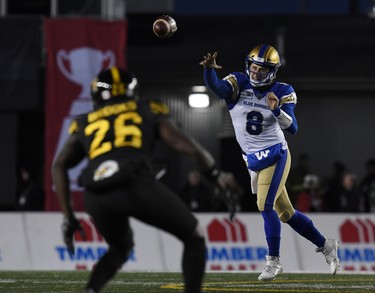Nov 24, 2019; Calgary, Alberta, CAN; Winnipeg Blue Bombers quarterback Zach Collaros (8) throws a pass as Hamilton Tiger-Cats defensive back Cariel Brooks (26) defends in the first half during the 107th Grey Cup championship football game at McMahon Stadium. Mandatory Credit: Eric Bolte-USA TODAY Sports