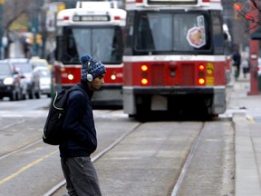 A man J-Walks across Spadina Ave in 2010. (Sun files)