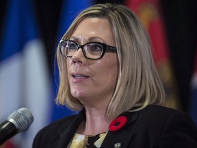Manitoba Environment Minister Rochelle Squires responds to a question during a news conference after a Canadian Council of Ministers of the Environment meeting in Vancouver on Friday, November 3, 2017. A new report says a Winnipeg hotel that was evacuated due to a carbon monoxide leak had no carbon monoxide detectors in place.