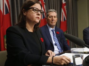 Manitoba Premier Brian Pallister listens in as Justice Minister Heather Stefanson speaks at the Manitoba Legislature in Winnipeg, Tuesday, November 7, 2017. Manitoba's families minister says only six weeks away from one of the largest reforms to the child-welfare system in Canadian history the federal government has not shared information about how it will be implemented or funded.