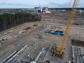 In this aerial view the construction site of the facility that will be on the receiving end of the Nord Stream 2 natural gas pipeline is seen as the former East Germany-era Greifswald nuclear power stations stands behind on March 26, 2019 in Lubmin, Germany.