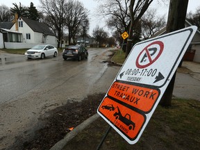 Street work signs line Wilton Avenue in Winnipeg on Sunday, April 16, 2017. Winnipeg won't add an urgent fall street sweeping program this year but the city will study the impact and cost of the idea.