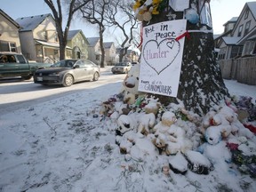 Fresh snow covers a large pile of cards and stuffed animals at the base of a tree in front of the Winnipeg home where a 3 year old boy was recently stabbed while he slept. The child has now died, and charges against the suspect are expected to be upgraded. Monday, November 04/2019 Winnipeg Sun/Chris Procaylo/stf