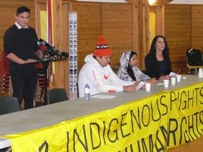 Rodney Bruce, a 25-year-old member of Grassy Narrows First Nation, who is also part of the First Nations Climate Change Adapt Program at the Kenora Chiefs Association, speaks to the media with (left to right) Grassy Narrows mercury survivor Steve (Darwin) Fobister, 22, and youth activist Paris Meekis, 15, and Ana Collins, Amnesty International Canada’s Indigenous Rights Campaign Advisor, sitting in front at a press conference at Thunderbird House in Winnipeg on Monday. Indigenous youth and mercury survivors from Grassy Narrows First Nation will be the focus of Amnesty International’s largest worldwide letter-writing campaign this year, the human rights organization announced.