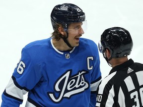 Winnipeg Jets captain Blake Wheeler disputes a point with referee Kendrick Nicholson during a break in action against the New Jersey Devils in Winnipeg on Tues., Nov. 5, 2019. Kevin King/Winnipeg Sun/Postmedia Network