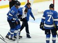 Jets’ Bryan Little is helped off the ice by teammate Nikolaj Ehlers and a member of the team’s medical staff on Nov. 6, 2019 at the Bell MTS Centre. Little is now unsure if he'll ever play again. Kevin King/Winnipeg Sun