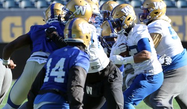 Running back Andrew Harris takes it up the middle during Winnipeg Blue Bombers practice on Wed., Nov. 6, 2019. Kevin King/Winnipeg Sun/Postmedia Network
