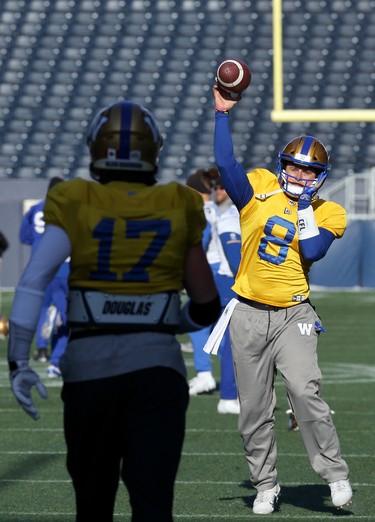 Quarterback Zach Collaros (right) throws with Chris Streveler during Winnipeg Blue Bombers practice on Wed., Nov. 6, 2019. Kevin King/Winnipeg Sun/Postmedia Network