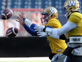 Quarterbacks Zach Collaros (left) and Chris Streveler take snaps during Winnipeg Blue Bombers practice on Wed., Nov. 6, 2019. Kevin King/Winnipeg Sun/Postmedia Network