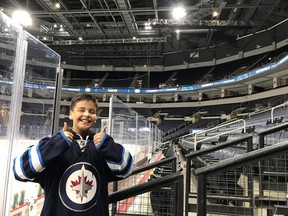 Ten-year-old Winnipeg Jets fan Drayton Perreault gives a big thumbs up at the Bell MTS Place in Winnipeg during his ultimate fan experience on Friday, prior to the Winnipeg Jets game against the Vancouver Canucks.