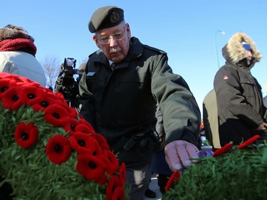 Royal Winnipeg Rifles Association president Gerald Woodman pins a poppy at the end of its Remembrance Day Service at Vimy Memorial Park in Winnipeg on Mon., Nov. 11, 2019. Kevin King/Winnipeg Sun/Postmedia Network