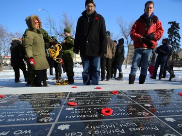 Poppies are laid on a memorial following the Royal Winnipeg Rifles Association Remembrance Day Service at Vimy Memorial Park in Winnipeg on Mon., Nov. 11, 2019. Kevin King/Winnipeg Sun/Postmedia Network