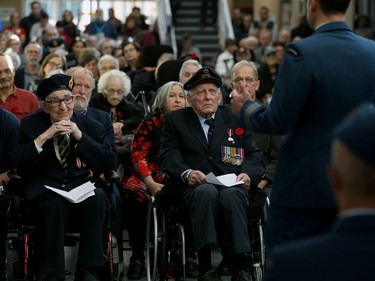 Veterans Edgar Clairmont (front left) and Ed Wirth (centre) listen as Col. Eric Charron, Commander of 17 Wing Winnipeg, speaks during a Remembrance Day service at Deer Lodge Centre in Winnipeg on Mon., Nov. 11, 2019. Kevin King/Winnipeg Sun/Postmedia Network