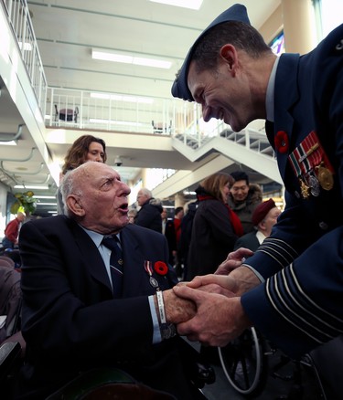Veteran Ed Wirth (left) is greeted by Col. Eric Charron, Commander of 17 Wing Winnipeg, after a Remembrance Day service at Deer Lodge Centre in Winnipeg on Mon., Nov. 11, 2019. Kevin King/Winnipeg Sun/Postmedia Network