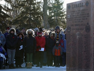 People try to stay warm during the Royal Winnipeg Rifles Association Remembrance Day Service at Vimy Memorial Park in Winnipeg on Mon., Nov. 11, 2019. Kevin King/Winnipeg Sun/Postmedia Network