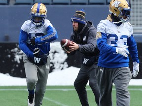 Quarterback Chris Streveler (centre) with running options Nic Demski (left) and Andrew Harris during Winnipeg Blue Bombers practice in Winnipeg on Wed., Nov. 13, 2019. Kevin King/Winnipeg Sun/Postmedia Network