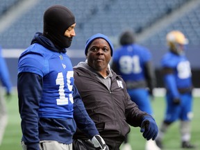 Defensive co-ordinator Richie Hall (right) chats with linebacker Kyrie Wilson during Winnipeg Blue Bombers practice in Winnipeg on Wednesday, Nov. 13.