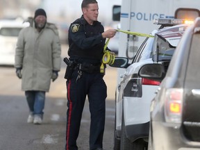 Police investigate a homicide in the 700 block of Dufferin Ave., in Winnipeg on Saturday, Nov. 16.