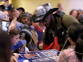 Winnipeg Blue Bombers defensive end Willie Jefferson signs autographs at Winnipeg James Armstrong Richardson International Airport on Mon., Nov. 25, 2019 after the team came home from Calgary with the Grey Cup. Kevin King/Winnipeg Sun/Postmedia Network